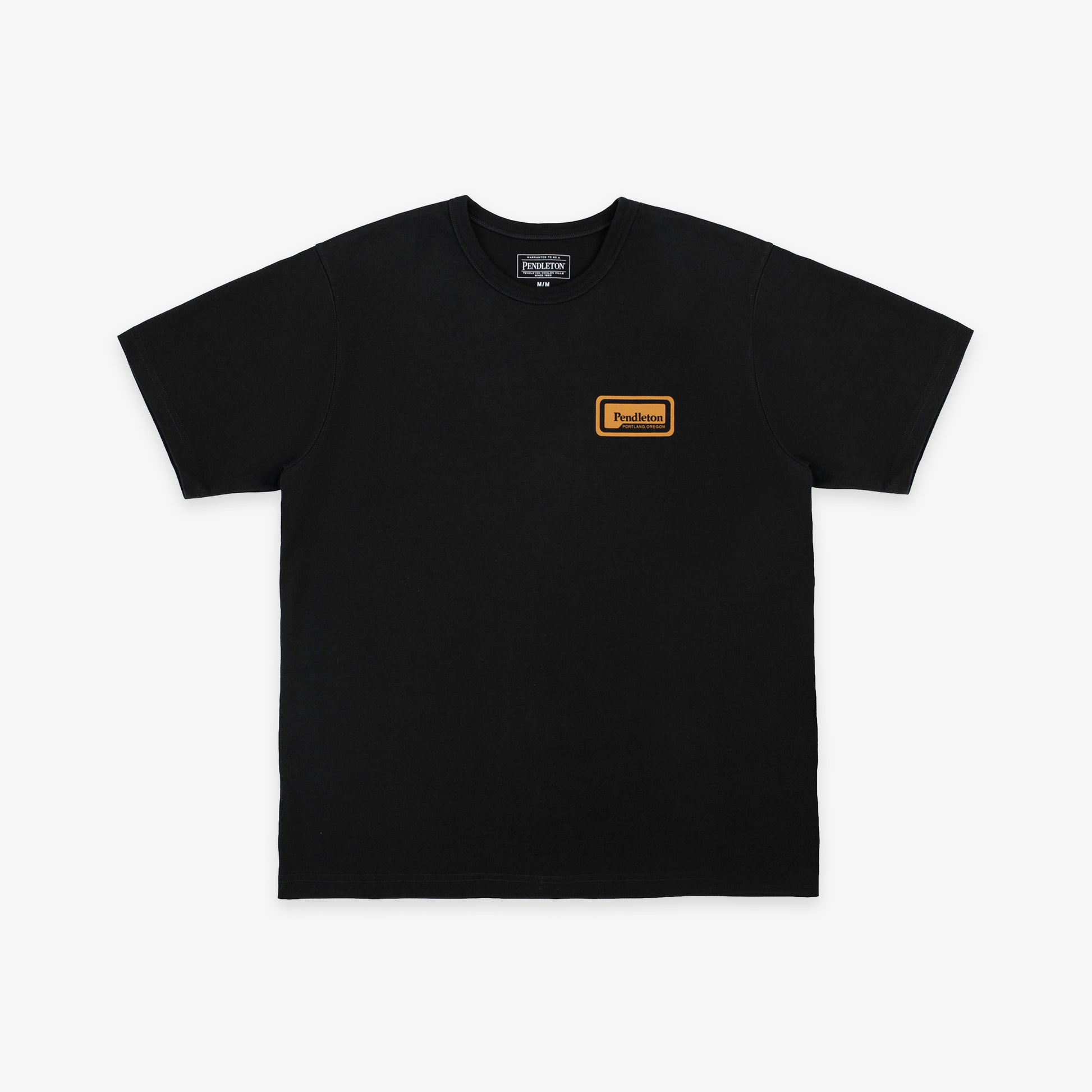 A black short-sleeve crewneck t-shirt with a small orange rectangular logo patch on the left chest, displayed flat against a light gray background.