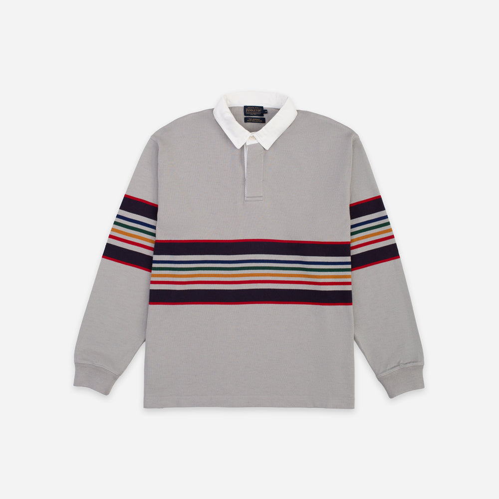 A light gray long-sleeve rugby shirt with a white collar and horizontal multicolor stripes across the chest and upper sleeves, shown flat on a light gray background.
